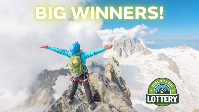 Person on top of snowy mountain with arms outstretched towards the blue sky. Big Winners! Colorado Lottery logo