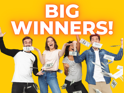 Big Winners! Group of four people excitedly celebrate as cash falls all around them.
