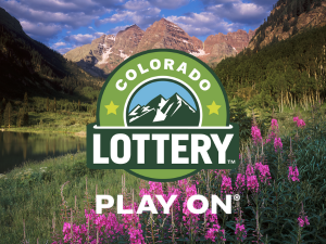 Maroon Bells - mountain peak with alpine lake surrounded by pink wildflowers. Colorado Lottery Logo - Play On